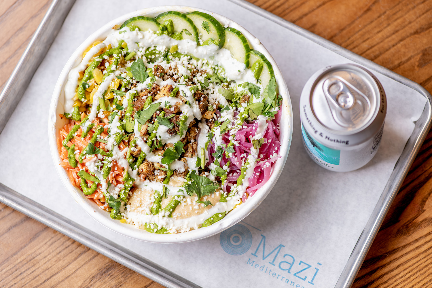 Mazi Mediterranean bowl with fresh toppings and sauces